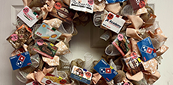 Decorative wreath adorned with gift cards and bows
